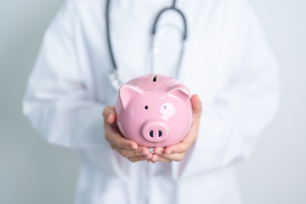 doctor with piggy bank